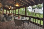 Main Level Screen Porch has a Hot Tub, Two Tables with Chairs 
